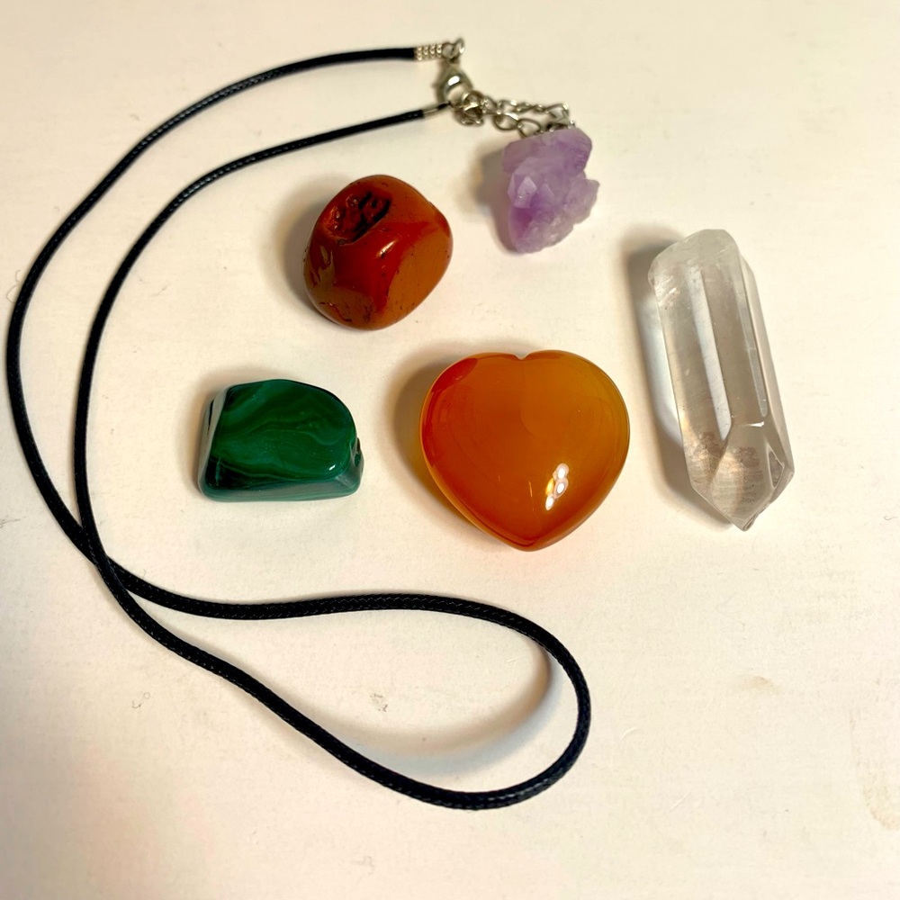 Collection of crystals including one necklace.